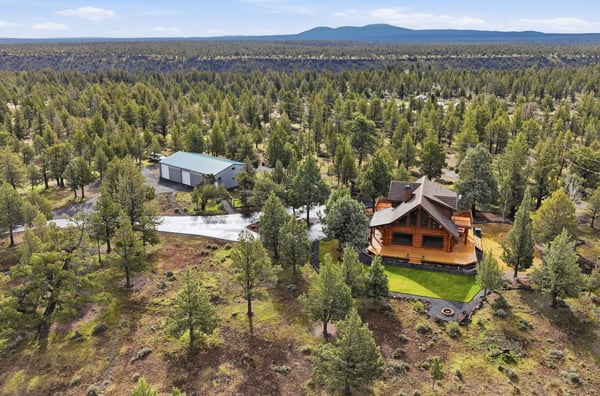 Stunning log home nestled on expansive, wooded land, offering privacy and breathtaking natural views.