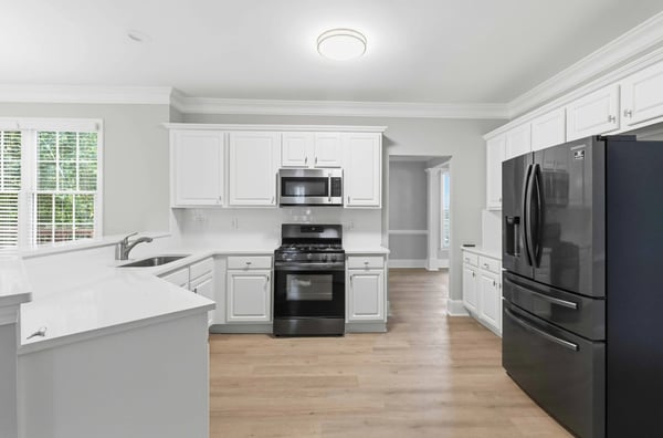 Bright and functional kitchen featuring modern appliances and open flow to living spaces for easy entertaining.