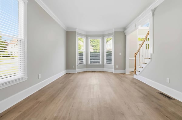 Bright and airy living space featuring large windows and flexible layout, perfect for customization and modern living.