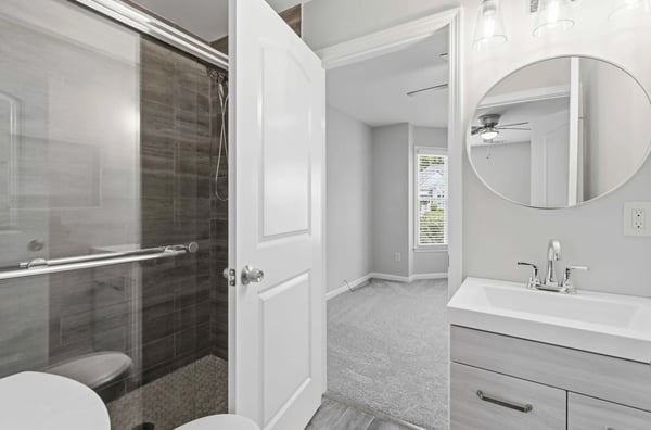 Modern Jack & Jill full bathroom addition with tile shower