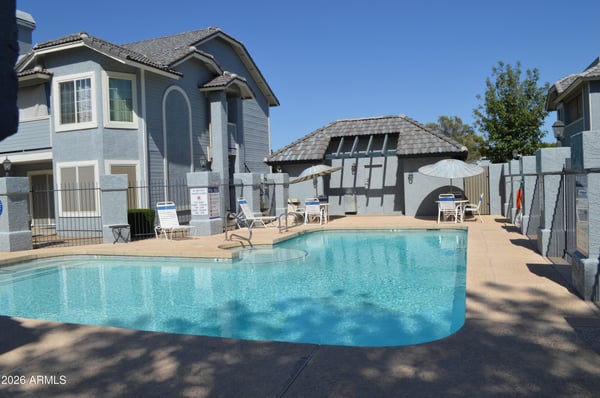 Well-maintained community pool surrounded by relaxing seating areas, shaded ramada, and professionally landscaped grounds. Designed for recreation and leisure, this Phoenix community offers exceptional outdoor amenities.