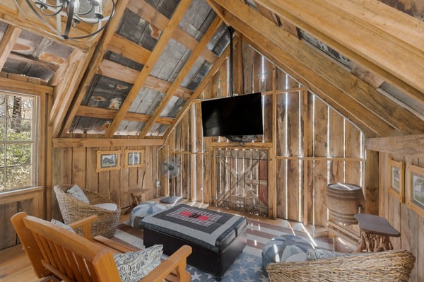 Cozy retreat featuring a rustic interior, perfect for relaxation or intimate gatherings in nature.