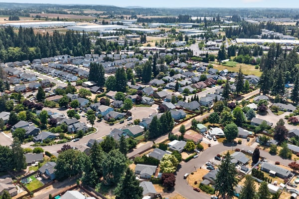 Spacious suburban community featuring tree-lined streets, diverse housing options, and abundant green spaces.