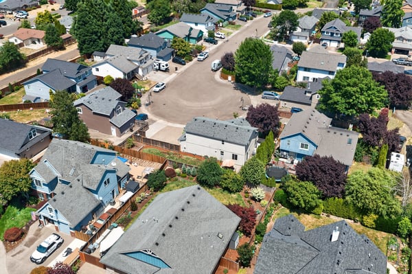 Spacious homes on tree-lined streets, showcasing a vibrant community and convenient access to amenities.
