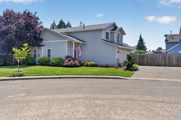 This well-maintained home features vibrant landscaping and ample outdoor space in a quiet cul-de-sac.
