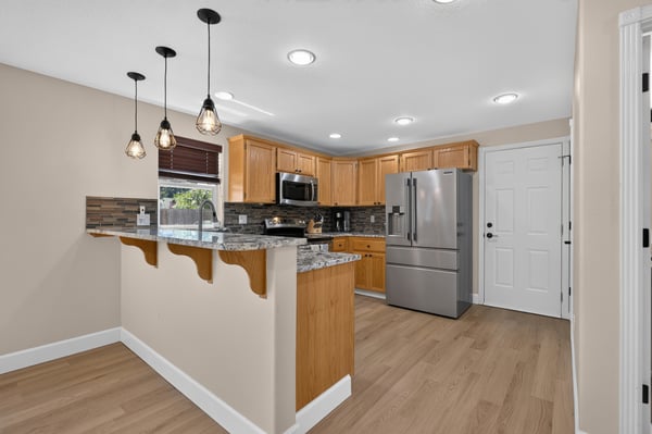 Modern kitchen with updated appliances, beautiful cabinetry, and inviting layout perfect for entertaining and cooking.