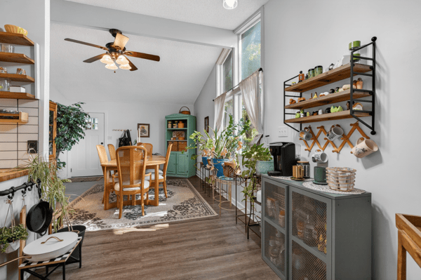 Bright and airy dining area featuring ample natural light and a cozy atmosphere for gatherings.