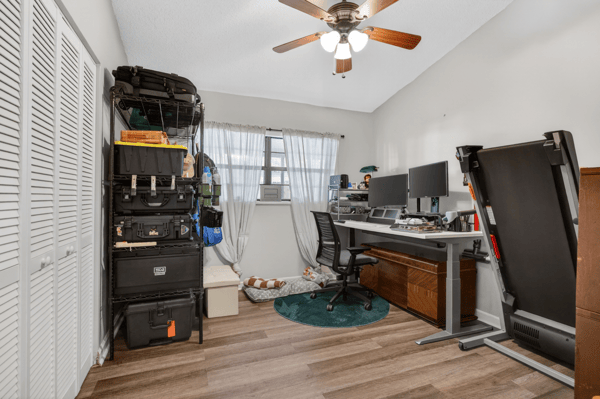 This versatile room offers ample storage, ideal for a home office or creative space.