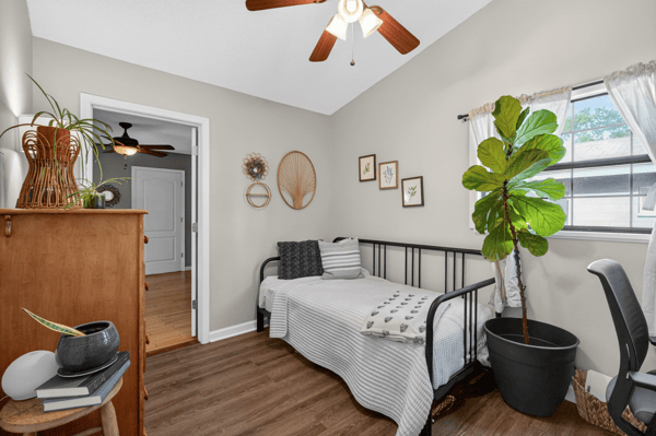 Bright and inviting bedroom featuring a cozy layout, and ample natural light.