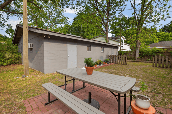 Spacious outdoor area features a picnic spot, perfect for gatherings and enjoying the natural landscape.