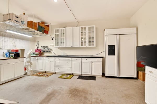 Spacious kitchen with ample cabinet storage and modern appliances, perfect for culinary enthusiasts and gatherings.