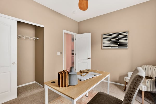 Bright and functional office space featuring built-in storage and a welcoming atmosphere for productivity.