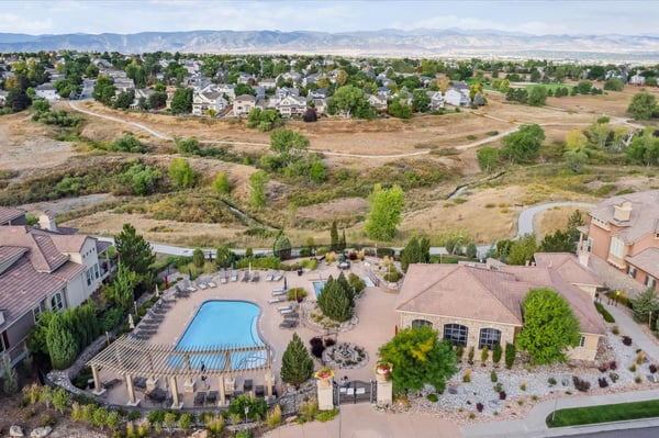 Nestled in nature, this community features a spacious pool surrounded by lush landscapes and scenic views.