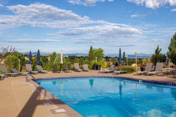 Enjoy stunning mountain views from this inviting pool area, perfect for relaxation and social gatherings.