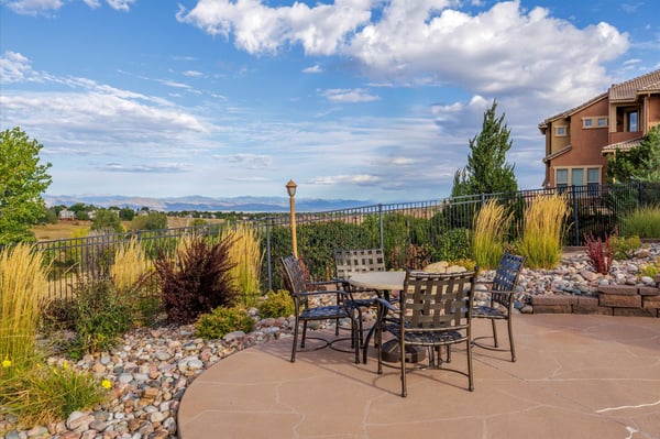 Discover a spacious outdoor patio with scenic views, perfect for gatherings and enjoying nature.