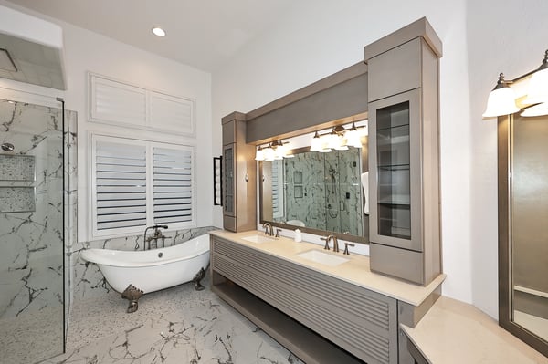 Primary bathroom featuring soaking tub, dual sinks, and modern finishes creates a spa-like Scottsdale retreat.