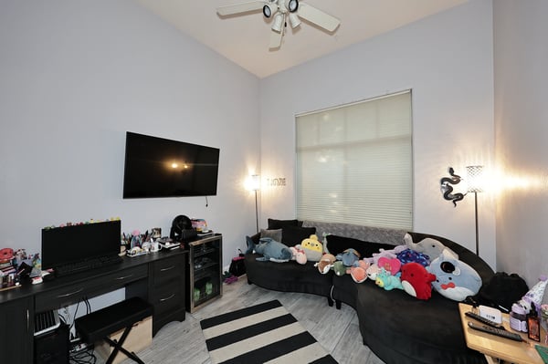 Flexible room with workspace setup, natural light, and modern flooring perfect for a Scottsdale office, bedroom, or hobby room.
