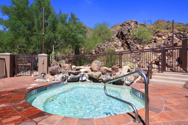 Outdoor spa surrounded by desert scenery offers a tranquil Scottsdale amenity perfect for relaxation and leisure.