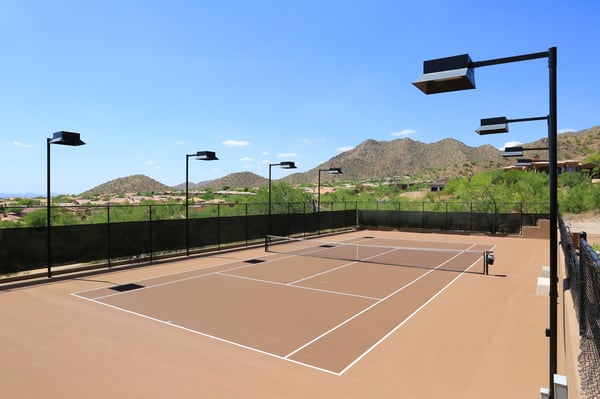 Well-maintained, lighted tennis court with scenic views supports an active Scottsdale lifestyle within the community.