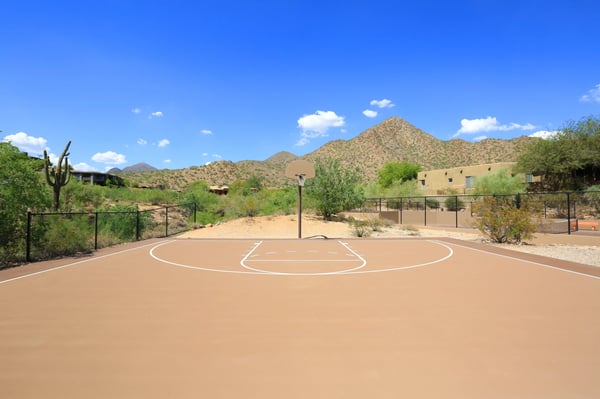 Outdoor basketball court within the Scottsdale community features scenic mountain surroundings, offering recreation and lifestyle amenities close to home.