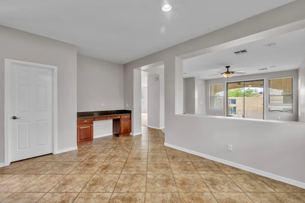 Built-in desk area provides a dedicated workspace, ideal for remote work or study within this well-designed Goodyear home.