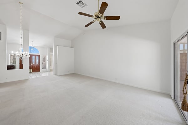 Open-concept living and dining spaces feature fresh paint, high ceilings, and bright interiors designed for comfortable Arizona living in Peoria.