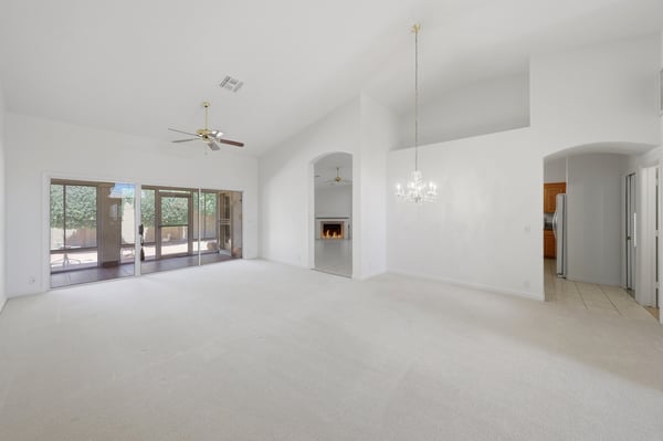 Light-filled dining room with stylish chandelier and open layout provides the perfect space for family meals and entertaining guests year-round.