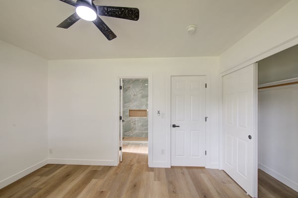 Bright windows, updated flooring, generous closet space, and contemporary finishes create a relaxing secondary bedroom that's ready for immediate enjoyment.
