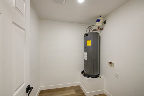 Conveniently designed, this laundry room includes washer and dryer hookups, an updated water heater, and extra utility space to simplify everyday household tasks.