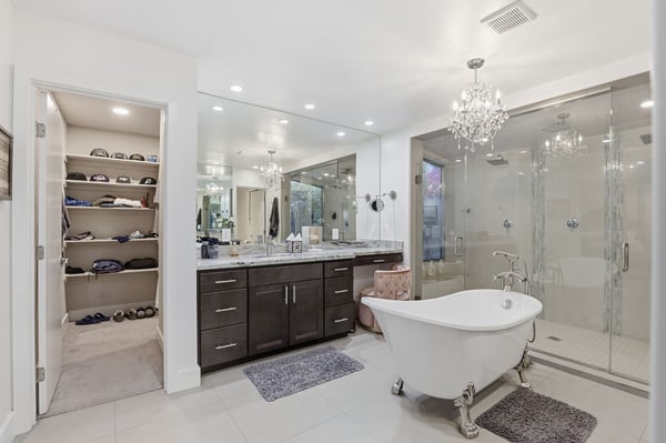 Convenient access from the luxurious primary bath leads to a spacious walk-in closet with abundant storage, enhancing everyday comfort and organization.