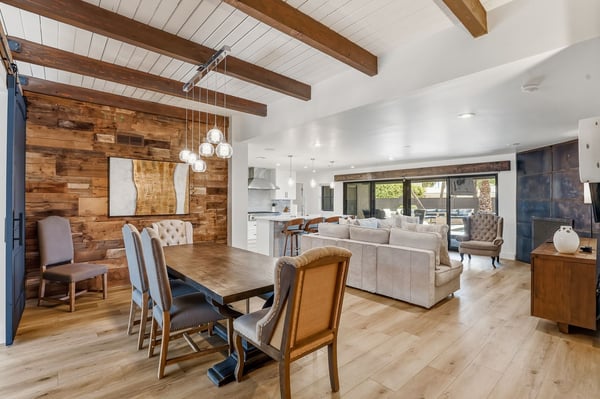 Spacious open living area blends the dining room, great room, and gourmet kitchen with rustic-modern finishes, creating a welcoming space for gatherings and everyday living.