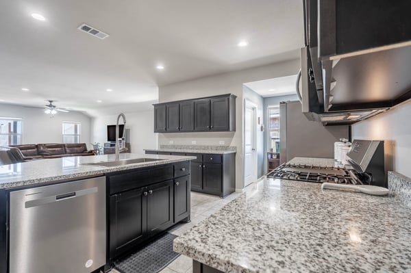 Modern kitchen featuring granite countertops, stainless steel appliances, and an open layout for seamless entertaining.