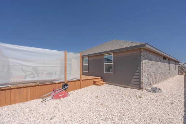 This spacious home features a low-maintenance backyard with ample outdoor potential and easy access to amenities.