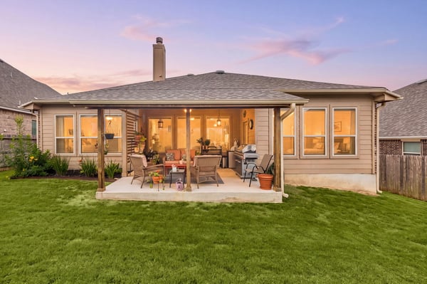 Discover a spacious outdoor patio perfect for entertaining, overlooking a manicured lawn in a desirable neighborhood.
