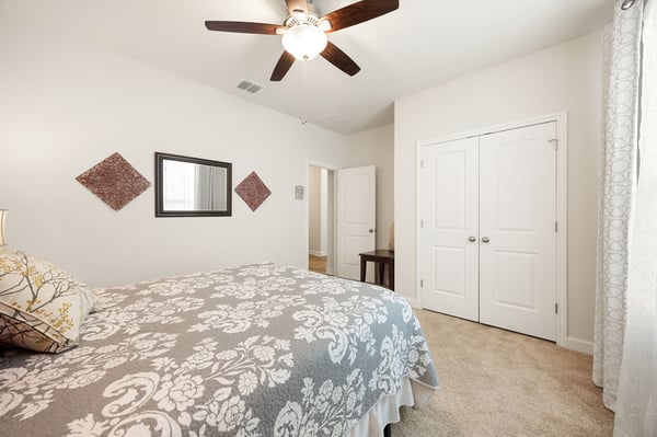 Cozy bedroom featuring modern fixtures, ample natural light, and convenient access to nearby amenities.