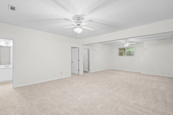 Spacious multi-purpose room with ample natural light, perfect for entertainment or relaxation in a versatile layout.