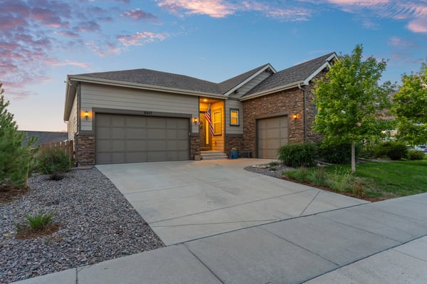 Beautifully designed home featuring a welcoming entrance and well-maintained landscaping in a peaceful neighborhood.