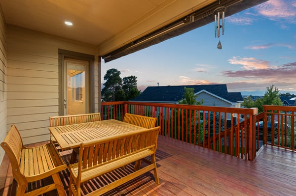 Spacious deck perfect for entertaining, featuring ample seating and scenic views of the surrounding landscape.