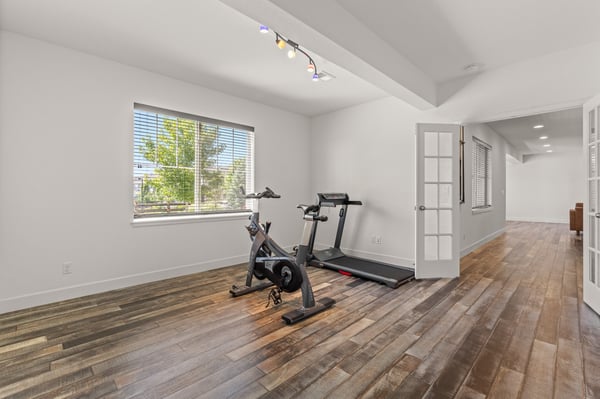 Bright, open space perfect for a home gym or versatile living area, featuring ample natural light.