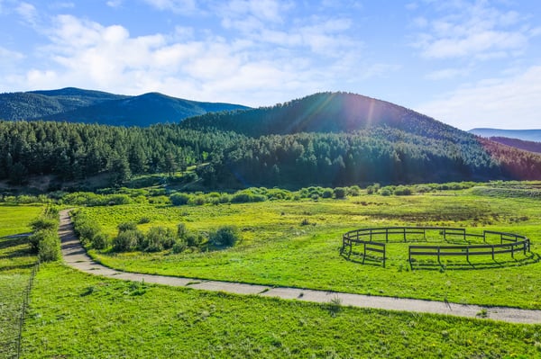 Scenic property featuring vast green pastures and stunning mountain views, ideal for your dream home or retreat.
