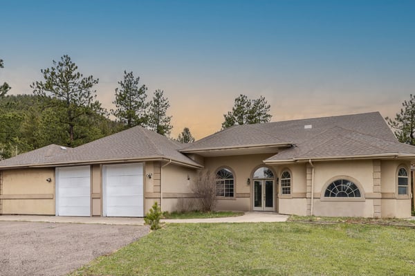 Modern home with generous space, large garage, and picturesque mountain views, perfect for outdoor enthusiasts.