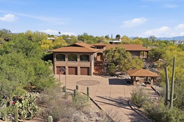 Nestled in desert greenery, this spacious home offers panoramic views and ample outdoor space for gatherings.