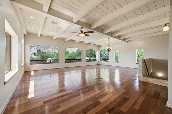 Spacious open-plan living area with abundant natural light and views, perfect for entertaining or relaxing.