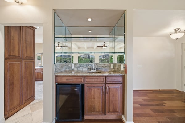 Spacious wet bar area ideal for entertaining, featuring modern finishes and seamless flow to living spaces.