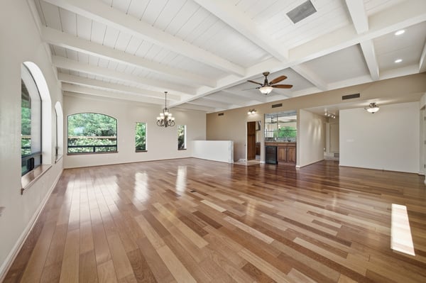 Spacious open floor plan featuring abundant natural light and beautiful hardwood floors throughout.