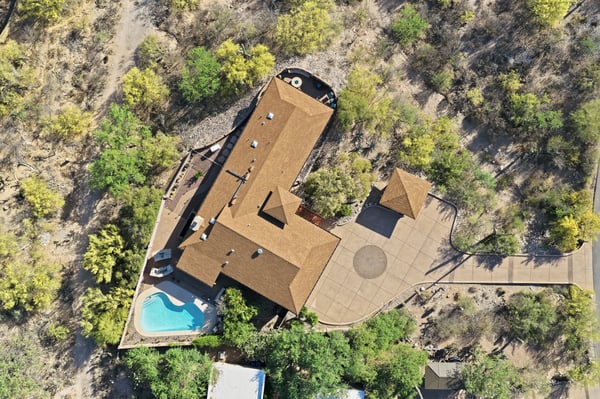 Sprawling property featuring a private pool, outdoor entertainment area, and expansive surrounding landscape for ultimate privacy.