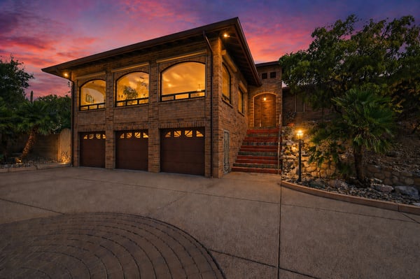 This inviting home features modern architecture, ample parking, and stunning sunset views in a desirable neighborhood.
