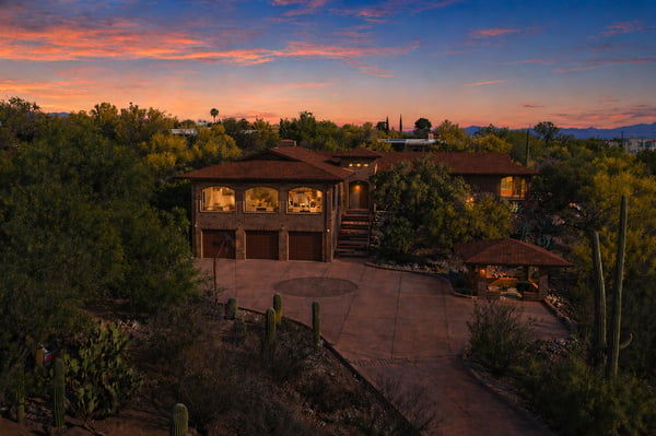 Discover this unique desert home, surrounded by lush landscapes and stunning sunset vistas, perfect for outdoor enthusiasts.