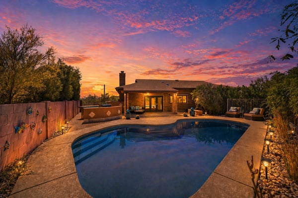 This spacious home features a beautifully lit pool area, perfect for evening relaxation and gatherings.