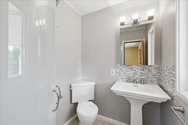 Modern bathroom featuring sleek fixtures, a spacious shower, and contemporary tile accents for a fresh look.